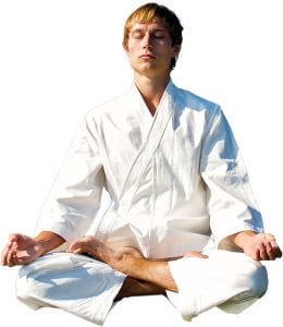 Martial Arts Lessons for Adults in Bayonne NJ - Young Man Thinking and Meditating in White