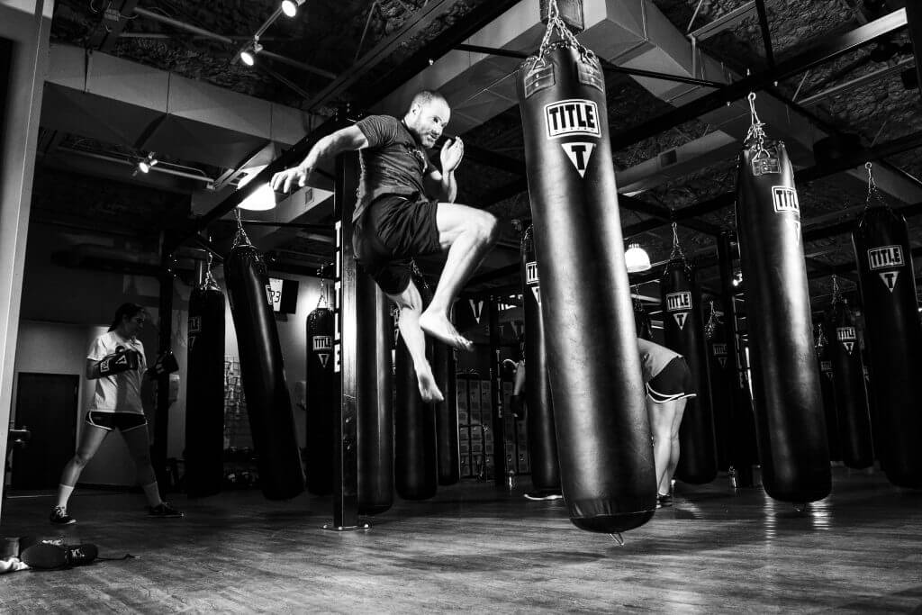 Mixed Martial Arts Lessons for Adults in Bayonne NJ - Jumping Knee man Black and White Background