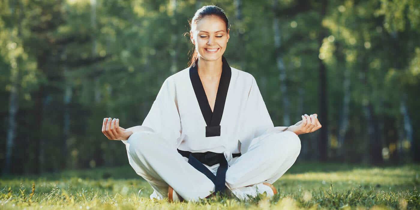 Martial Arts Lessons for Adults in Bayonne NJ - Happy Woman Meditated Sitting Background